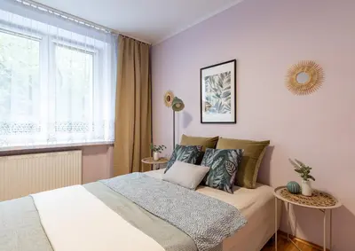 Łóżko lub łóżka w pokoju w obiekcie Stępińska Apartment near Royal Łazienki by Mia