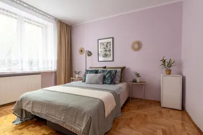 Łóżko lub łóżka w pokoju w obiekcie Stępińska Apartment near Royal Łazienki by Mia