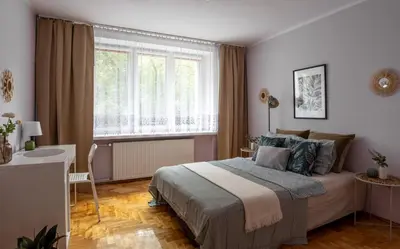 Łóżko lub łóżka w pokoju w obiekcie Stępińska Apartment near Royal Łazienki by Mia