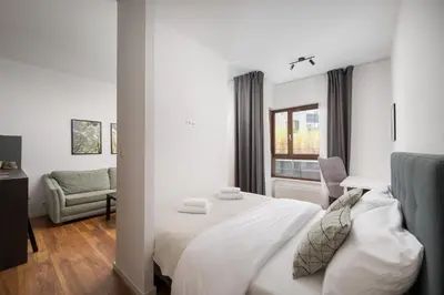 Łóżko lub łóżka w pokoju w obiekcie Royal Wilanów Chic Studio