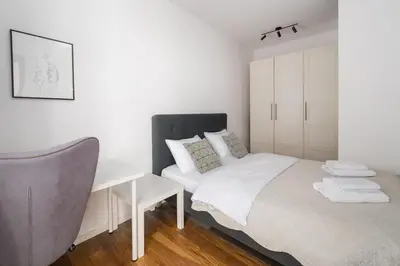 Łóżko lub łóżka w pokoju w obiekcie Royal Wilanów Chic Studio