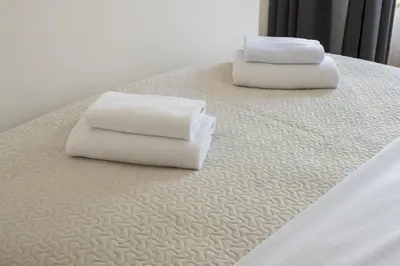 Łóżko lub łóżka w pokoju w obiekcie Royal Wilanów Chic Studio