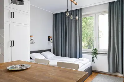 Łóżko lub łóżka w pokoju w obiekcie RentPlanet - Studio przy Parku Szczęśliwickim