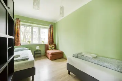 Łóżko lub łóżka w pokoju w obiekcie Labo Apartment Muranów