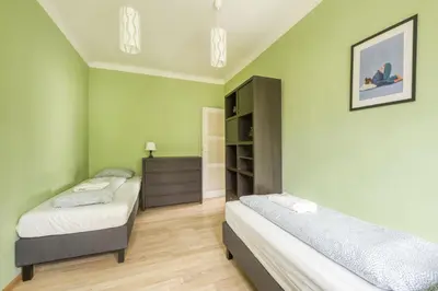 Łóżko lub łóżka w pokoju w obiekcie Labo Apartment Muranów