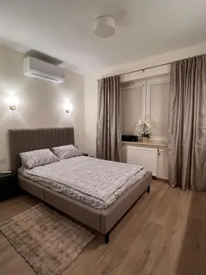Łóżko lub łóżka w pokoju w obiekcie Apartament 70 Metro