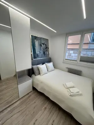 Łóżko lub łóżka w pokoju w obiekcie Stare Miasto - Apartament Trębacka