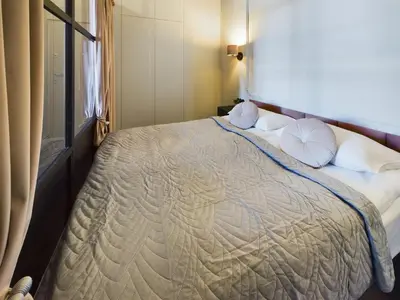 Łóżko lub łóżka w pokoju w obiekcie Wyjątkowy Apartament z Widokiem na Pałac Kultury by Noclegi Renters
