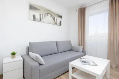 Część wypoczynkowa w obiekcie Pileckiego Apartments with Parking & Balcony by Noclegi Renters