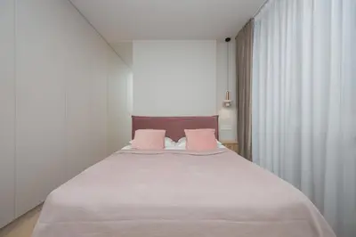 Łóżko lub łóżka w pokoju w obiekcie Pileckiego Apartments with Parking & Balcony by Noclegi Renters
