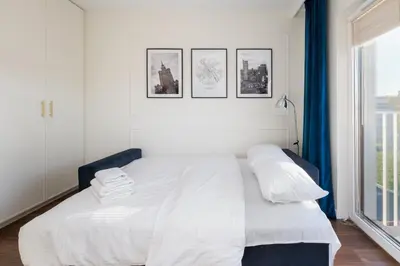 Łóżko lub łóżka w pokoju w obiekcie Praga Bliska Glamour Studio by BookingHost
