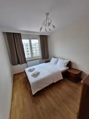 Łóżko lub łóżka w pokoju w obiekcie Rayskiego Premium Apartment
