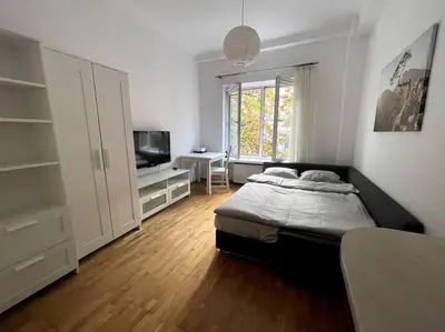 Łóżko lub łóżka w pokoju w obiekcie Cosy central apartment