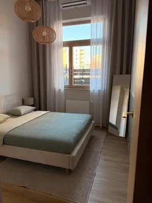 Łóżko lub łóżka w pokoju w obiekcie Kolejowa High Apartment