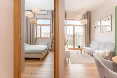 Łóżko lub łóżka w pokoju w obiekcie Kolejowa High Apartment