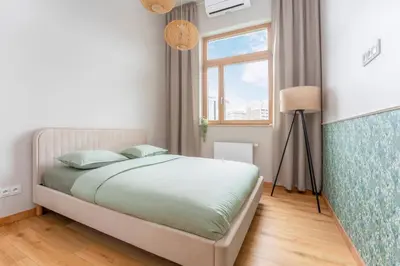 Łóżko lub łóżka w pokoju w obiekcie Kolejowa High Apartment