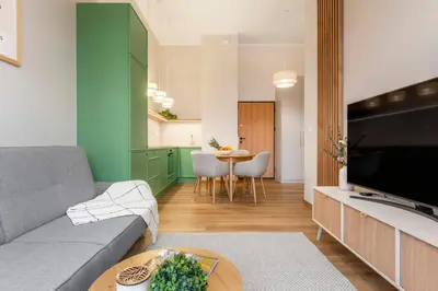 Telewizja i/lub zestaw kina domowego w obiekcie Kolejowa High Apartment
