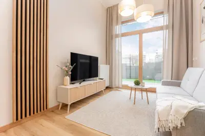 Telewizja i/lub zestaw kina domowego w obiekcie Kolejowa High Apartment