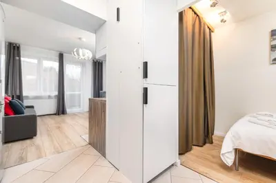 Łóżko lub łóżka w pokoju w obiekcie Apartament Dąbrowskiego by Your Freedom