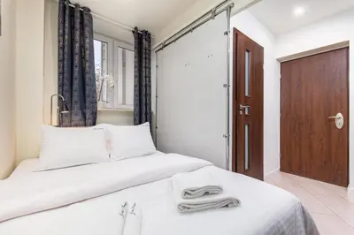 Łóżko lub łóżka w pokoju w obiekcie Apartament Dąbrowskiego by Your Freedom