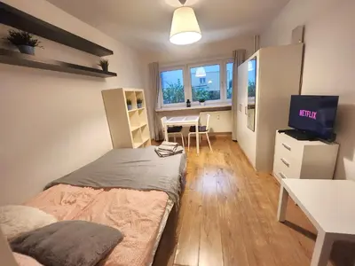 Łóżko lub łóżka w pokoju w obiekcie DeLux15 - Apartament Chmielna