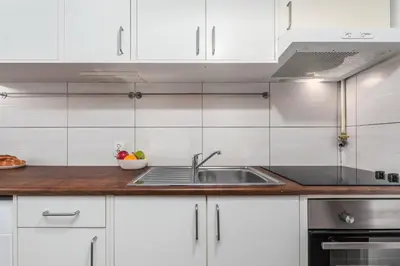 Kuchnia lub aneks kuchenny w obiekcie DeLux15 - Apartament Chmielna