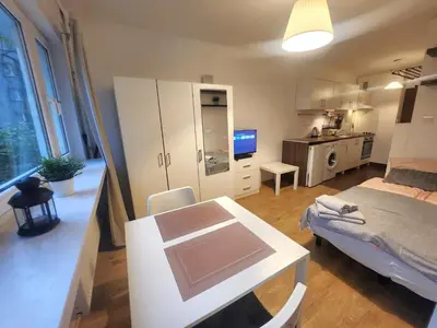 Łóżko lub łóżka w pokoju w obiekcie DeLux15 - Apartament Chmielna