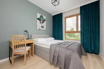 Łóżko lub łóżka w pokoju w obiekcie Ludwiki Premium Apartment