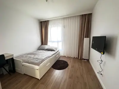 Łóżko lub łóżka w pokoju w obiekcie KASKADY Airport modern apartments - close to the airport - 10 min, and city center - 15 min