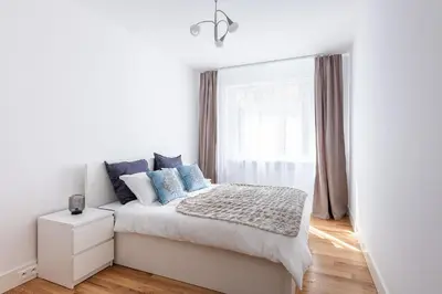Łóżko lub łóżka w pokoju w obiekcie Sadyba apartament