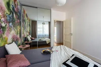 Łóżko lub łóżka w pokoju w obiekcie Sadyba apartament