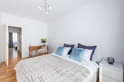 Łóżko lub łóżka w pokoju w obiekcie Sadyba apartament