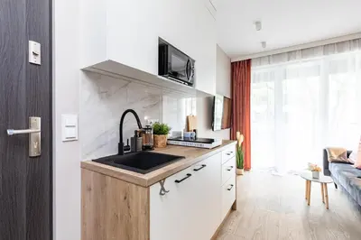 Kuchnia lub aneks kuchenny w obiekcie miniSTUDIOS URSUS by VAYA STAYS