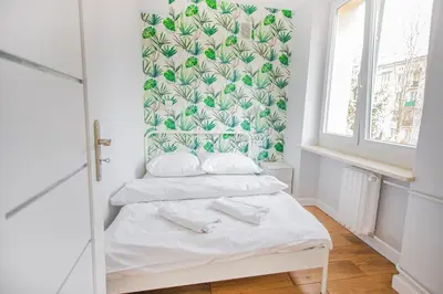 Łóżko lub łóżka w pokoju w obiekcie Cozy 1-bedroom flat next to the City Center