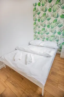 Łóżko lub łóżka w pokoju w obiekcie Cozy 1-bedroom flat next to the City Center
