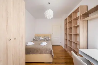 Łóżko lub łóżka w pokoju w obiekcie TOP Spot Warszawa Centrum Apartment by BookingHost