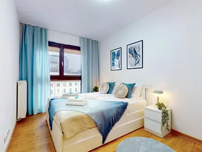 Łóżko lub łóżka w pokoju w obiekcie Vista Apartment Balcony AC Parking Metro Plocka