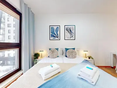 Łóżko lub łóżka w pokoju w obiekcie Vista Apartment Balcony AC Parking Metro Plocka