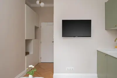 Telewizja i/lub zestaw kina domowego w obiekcie Urban Heart Deluxe Studios by BookingHost