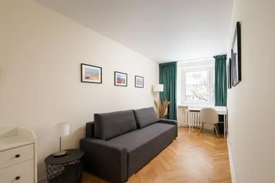 Część wypoczynkowa w obiekcie Warszawa Powiśle Spacious Apartment by BookingHost