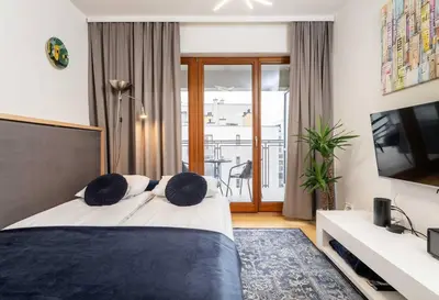 Łóżko lub łóżka w pokoju w obiekcie Urban Blue 2 Bedroom Apartment Wola