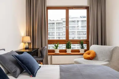 Łóżko lub łóżka w pokoju w obiekcie Urban Blue 2 Bedroom Apartment Wola