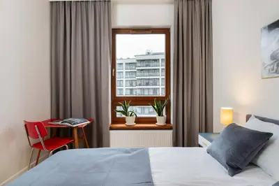 Łóżko lub łóżka w pokoju w obiekcie Urban Blue 2 Bedroom Apartment Wola