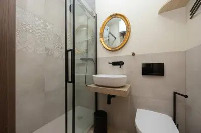Łazienka w obiekcie Elegant and Bright Apartment Graniczna near Ogród Saski by Noclegi Renters