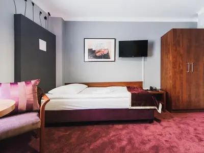 Łóżko lub łóżka w pokoju w obiekcie Hotel Chmielna Warsaw