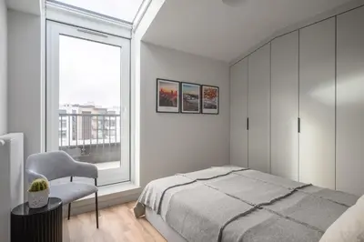Łóżko lub łóżka w pokoju w obiekcie Apartament na Herbu Oksza 18
