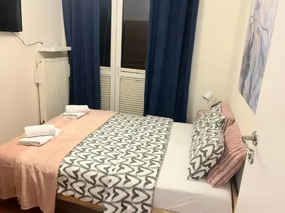 Łóżko lub łóżka w pokoju w obiekcie Rental Apartments Racławicka