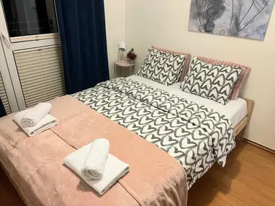Łóżko lub łóżka w pokoju w obiekcie Rental Apartments Racławicka