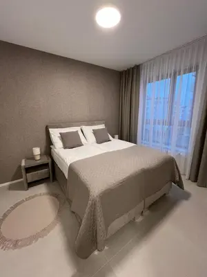 Łóżko lub łóżka w pokoju w obiekcie TM APARTMENTS Ludwiki