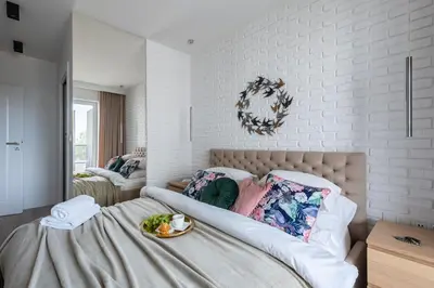 Łóżko lub łóżka w pokoju w obiekcie Luxurious Apartment Warsaw Mokotow